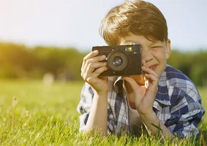 A picture of a boy that is preparing to make a picture