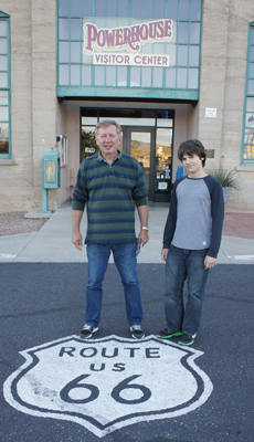 A picture of the family next to the Route 66 sign